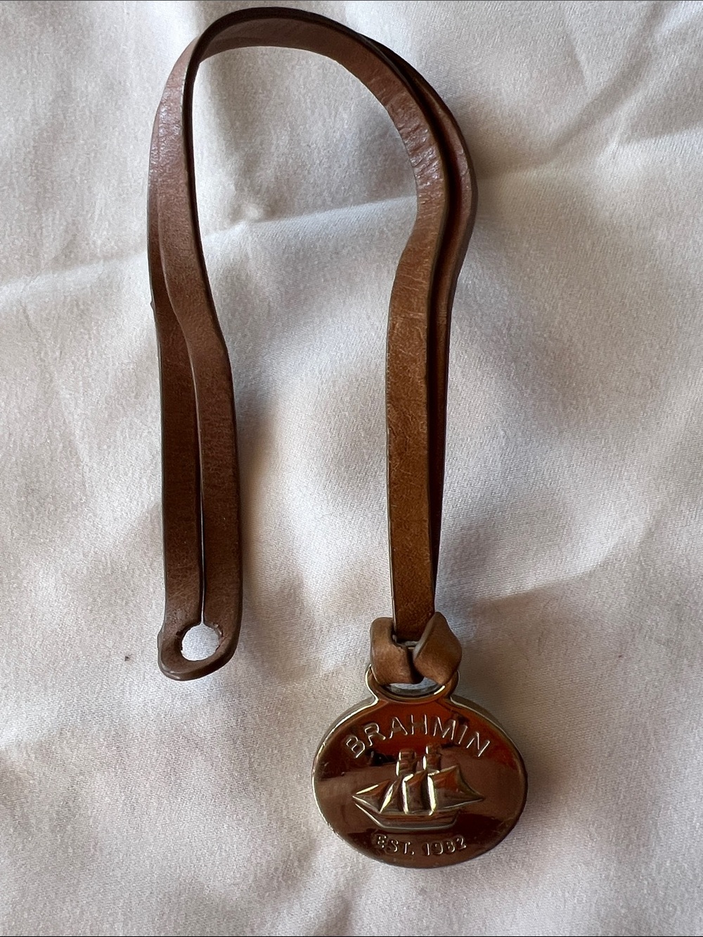 Brahmin charm medallion with leather hanging holder